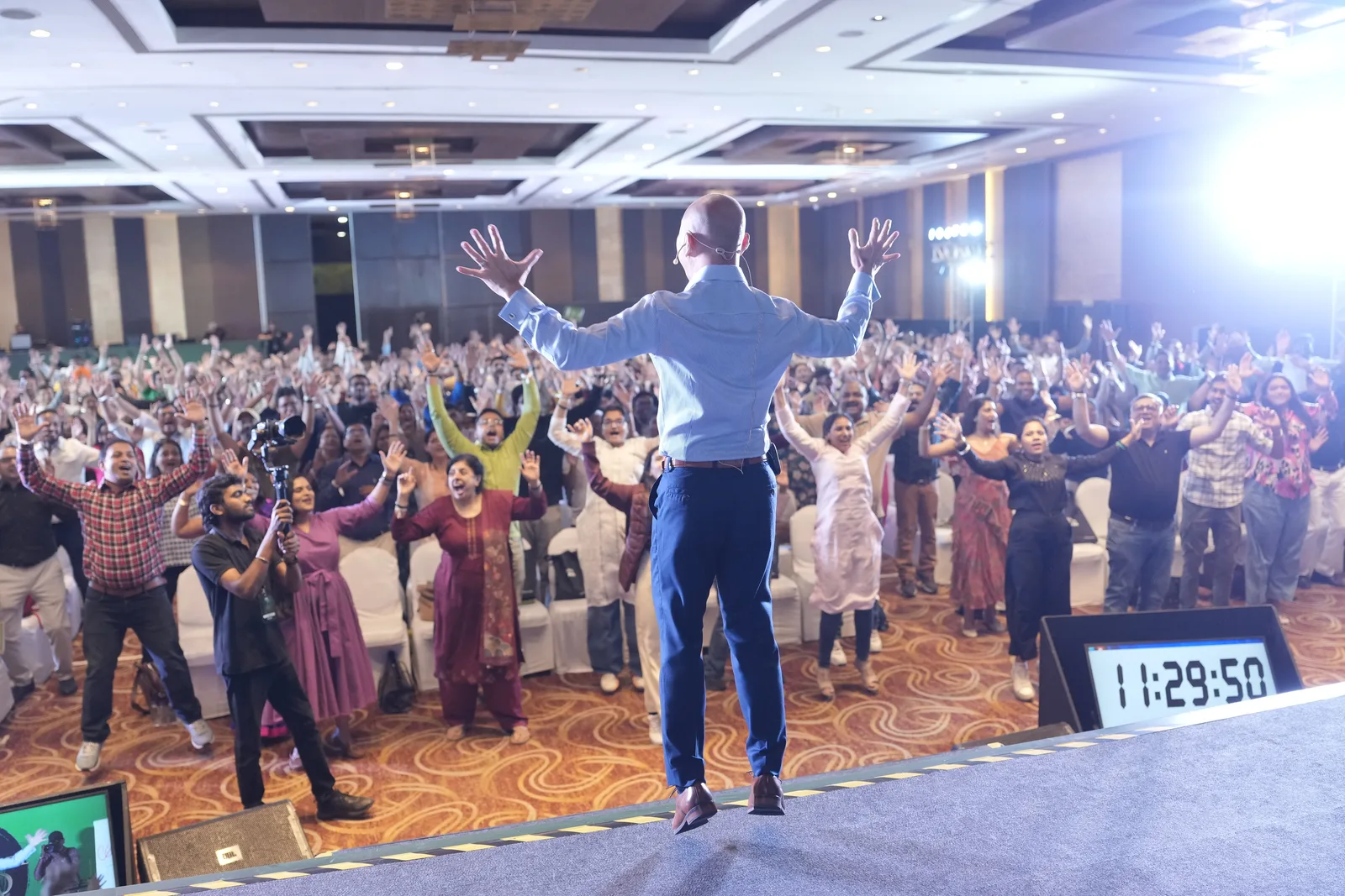 Suren leading a Millionaire Mind Intensive audience